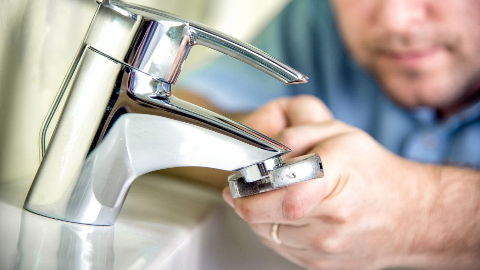 Dripping kitchen tap showing a common household plumbing problem
